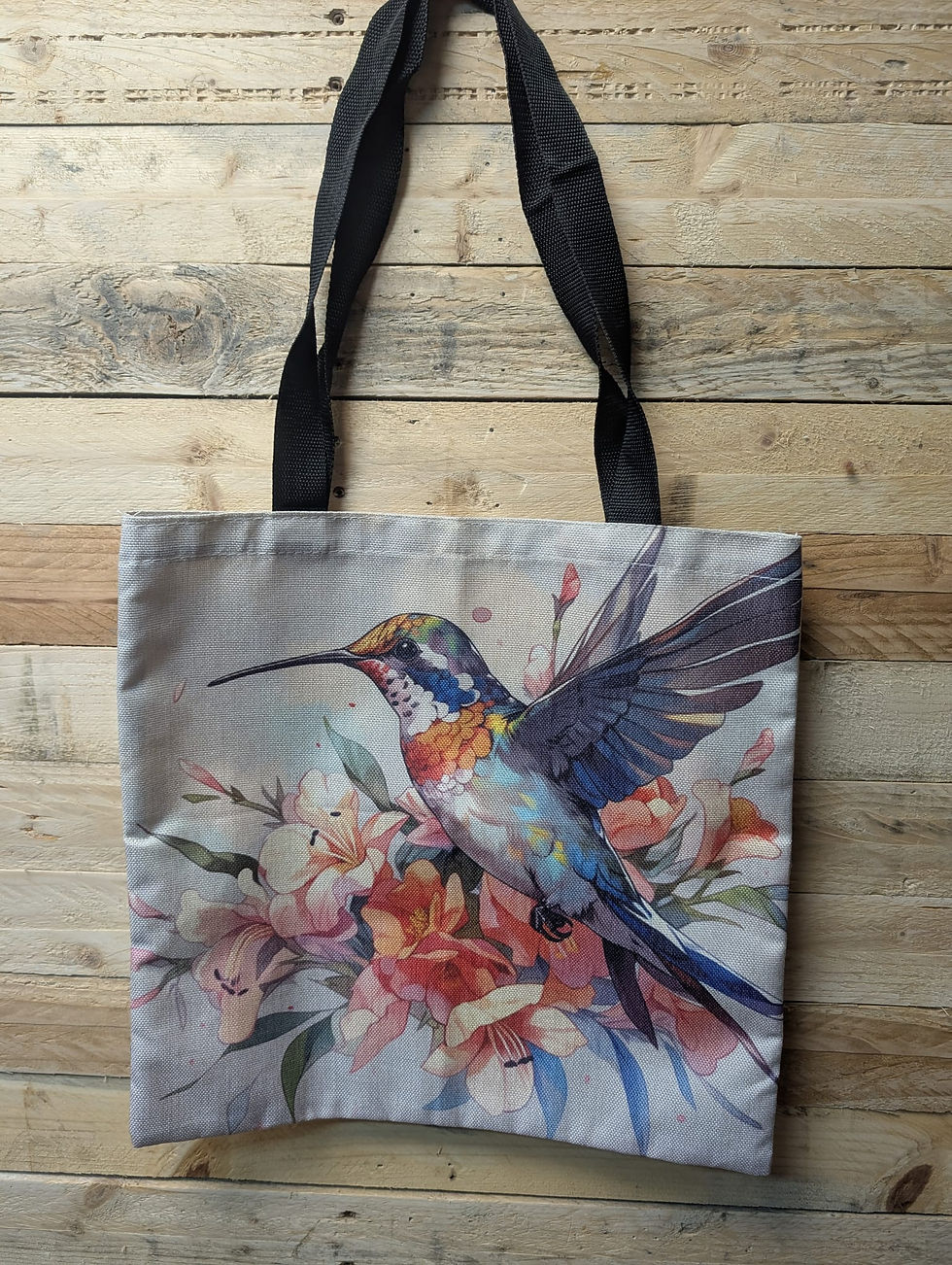 Magnifique Tote bag colibri aux plumes multicolore qui s'envole sur fond crème Format très pratique pour vie tous les jours