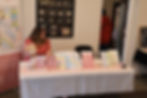 HB designs at a vendor table