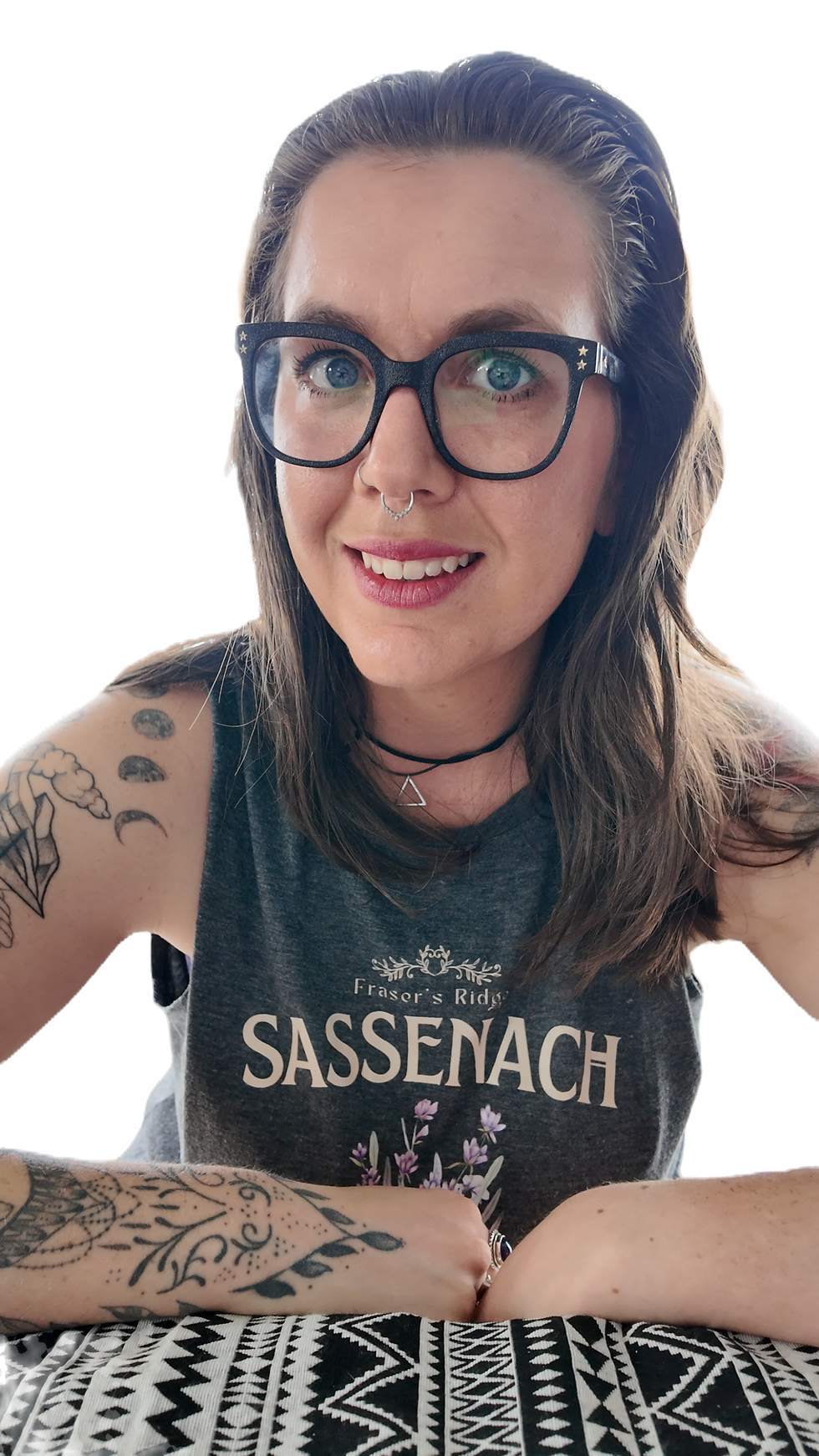 Woman with glasses and arm tattoos wearing a Sassenach shirt