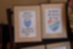 Two framed prints with hearts and inspirational quotes.