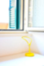 A retro-inspired 60s desk with a colorful abat-jour, adding a touch of vintage charm to the modern space of Casa Pesa. This stylish holiday home in Pigneto blends nostalgic design with contemporary comfort, creating an ideal setting for relaxation and productivity. Perfect for those enjoying Rome holidays or working remotely in a trendy apartment in Pigneto Rome, Casa Pesa offers a unique and welcoming atmosphere.