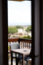 Casa Relli holiday home in Rome South near Tor Vergata – balcony with table and chairs overlooking the park, perfect for dining or relaxing with a book