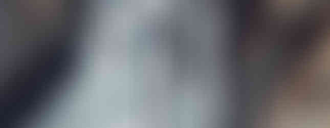 marukuyama standing below frozen waterfall in kinunuma nikko