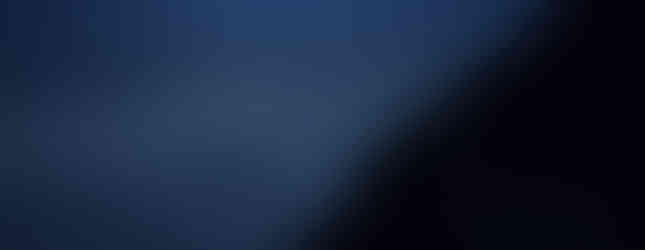 the moon shining on the summit of Fuji-san at night