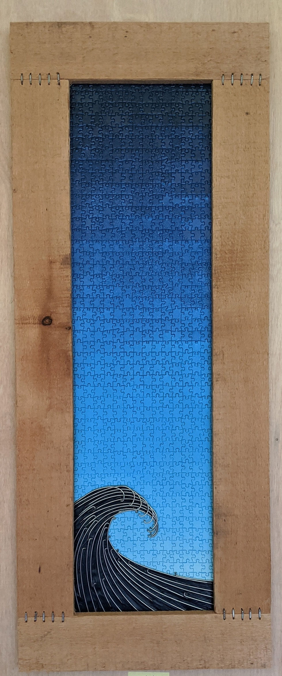 wave of recycled materials bike spokes bicycle chain wire scrap wood cable recycled art blue skies sunset puzzle