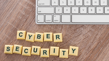 Cyber security tools for businesses in 2026 concept with computer keyboard and text on wooden background