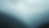 High angle view of misty mountains under a cloudy sky