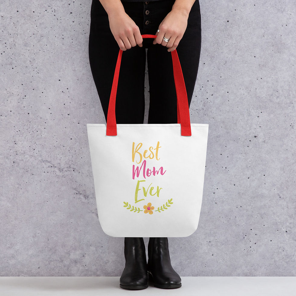 Model holding tote bag with graphic saying best mom ever.