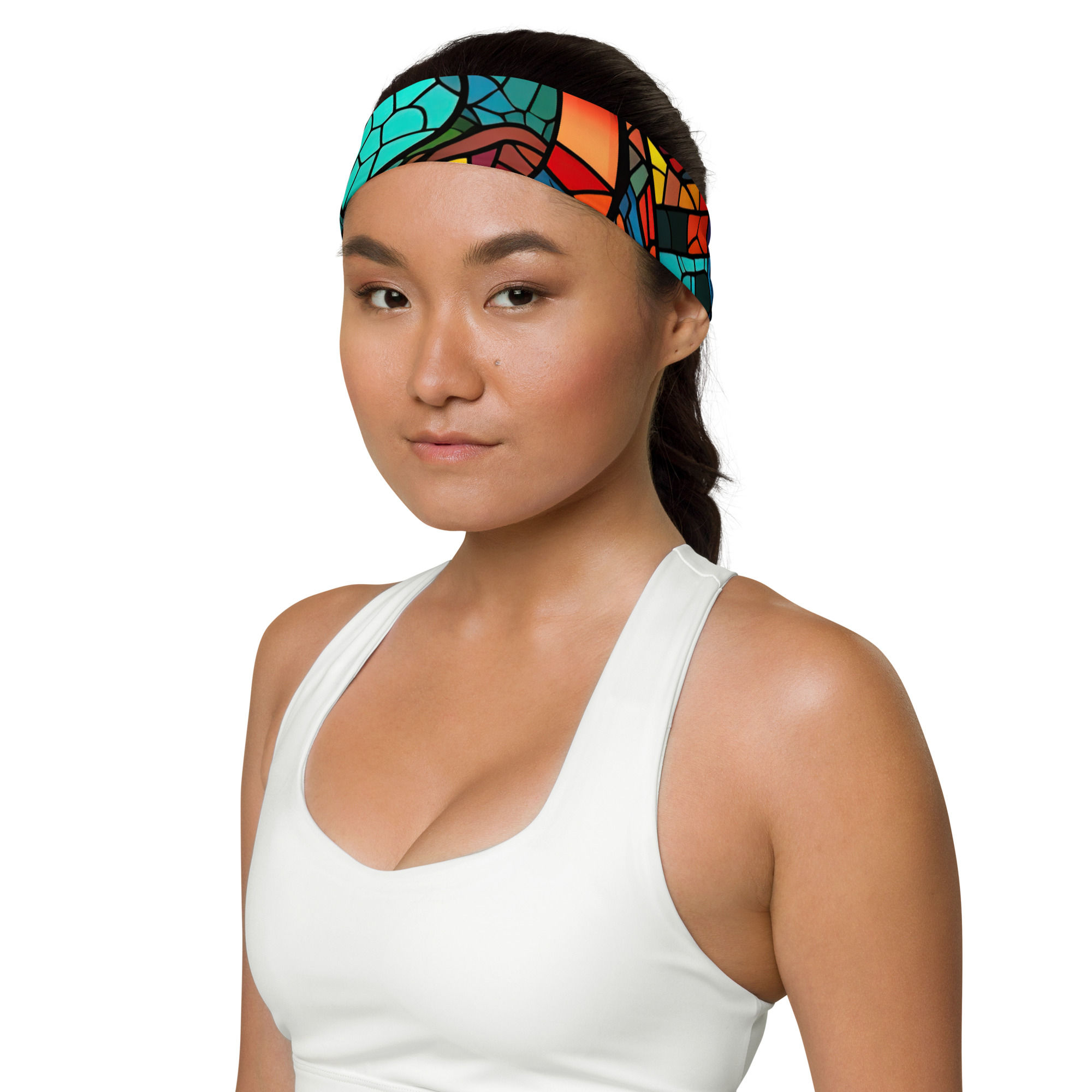 Model wearing headband with design of multicolor swirl in stained glass pattern.