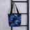 Thumbnail: Tote bag with a alcohol ink pattern of dark blue and gold.