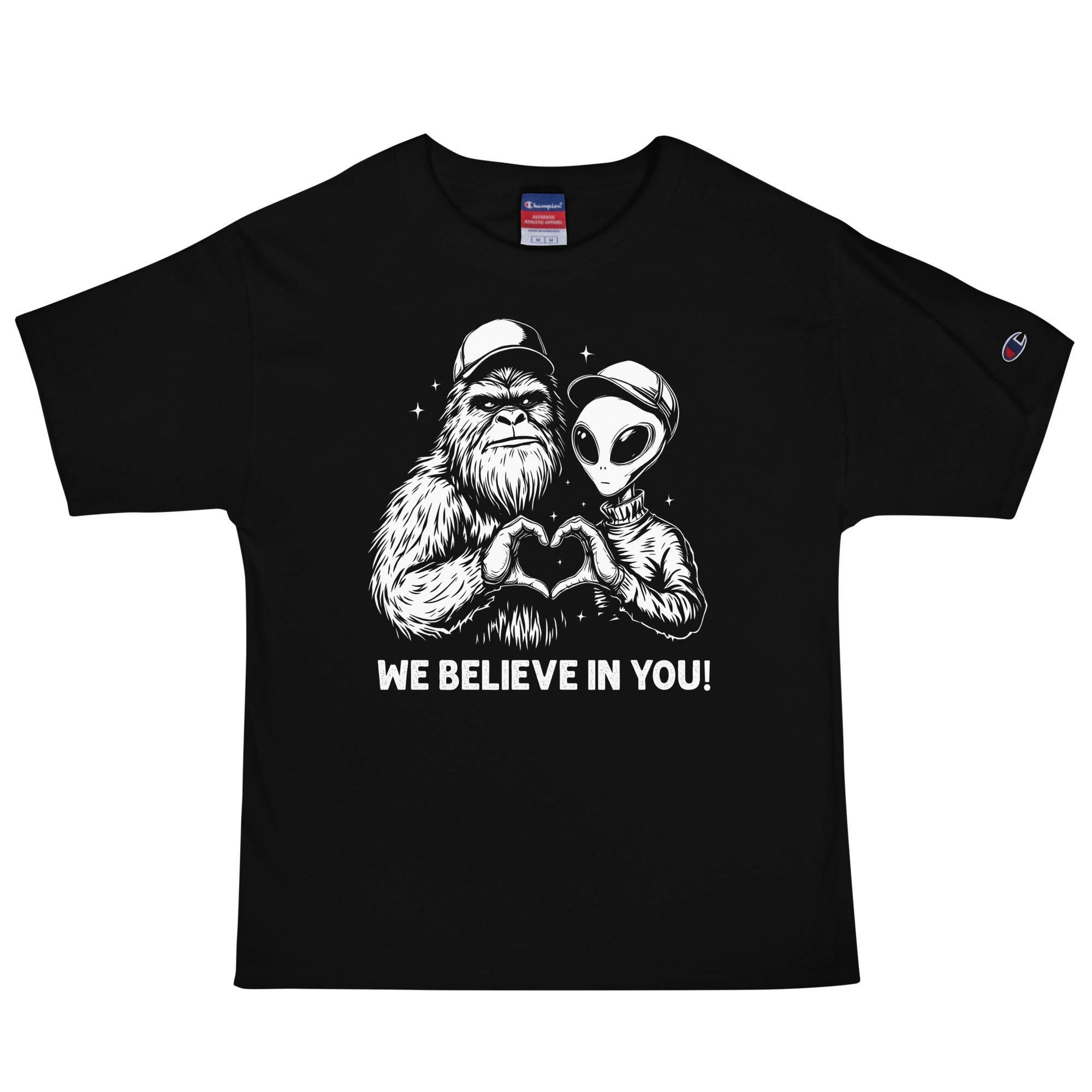Champion t-shirt with a graphic of bigfoot and alien saying we believe in you.