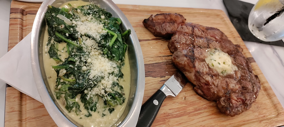 Entrées come with a side. Here, creamed spinach with the ribeye steak.