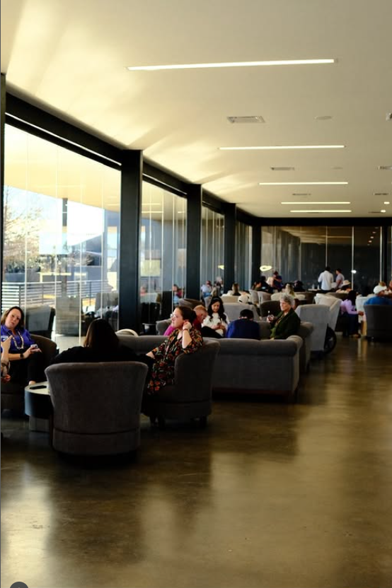 The tasting room is a large part of the main floor of the winery building and is like the lobby of a modern 5-star hotel.