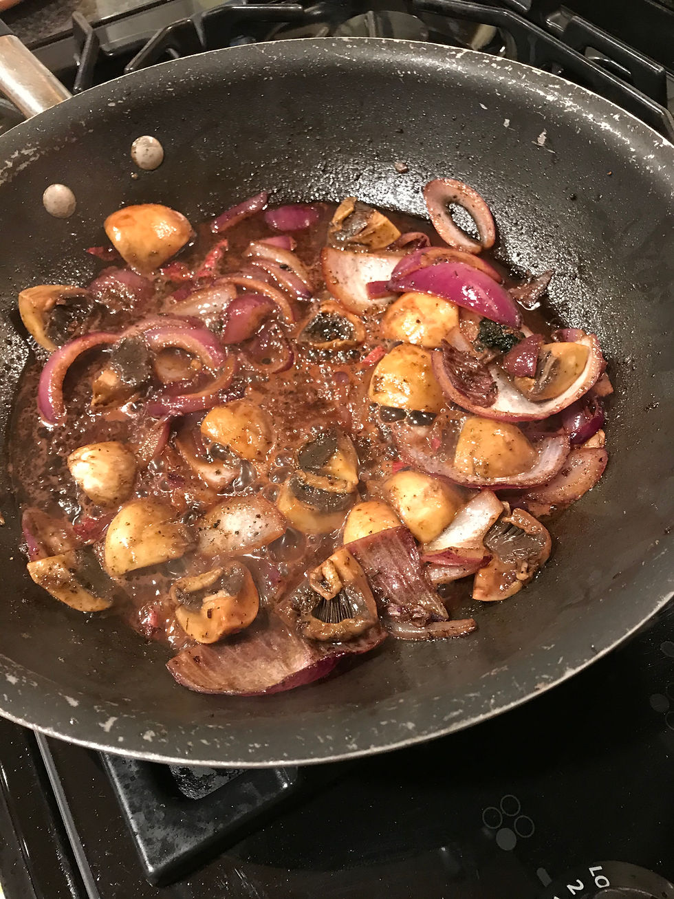 The recipe specified one medium onion so I used half a large red one left over from something else. For a quarter of a pound of small fresh mushrooms halved I used a handful of medium fresh mushrooms quartered. After a few minutes all is soft and the onions give up their sweetness.