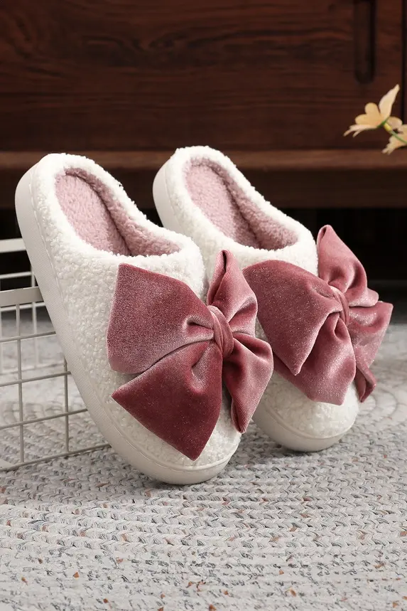 White fluffy slippers with pink bows