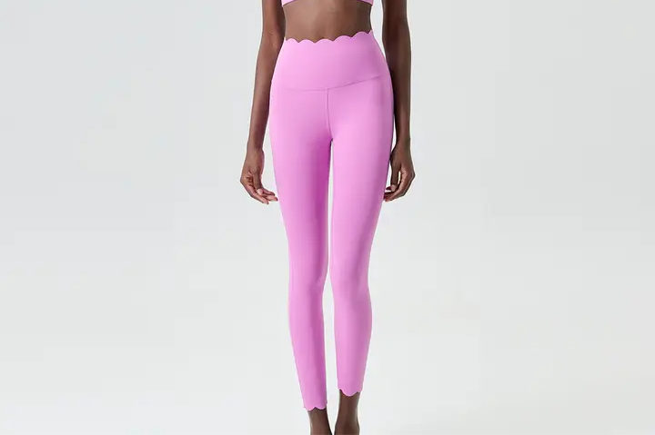 Pink yoga tights with scalloped waist and ankles