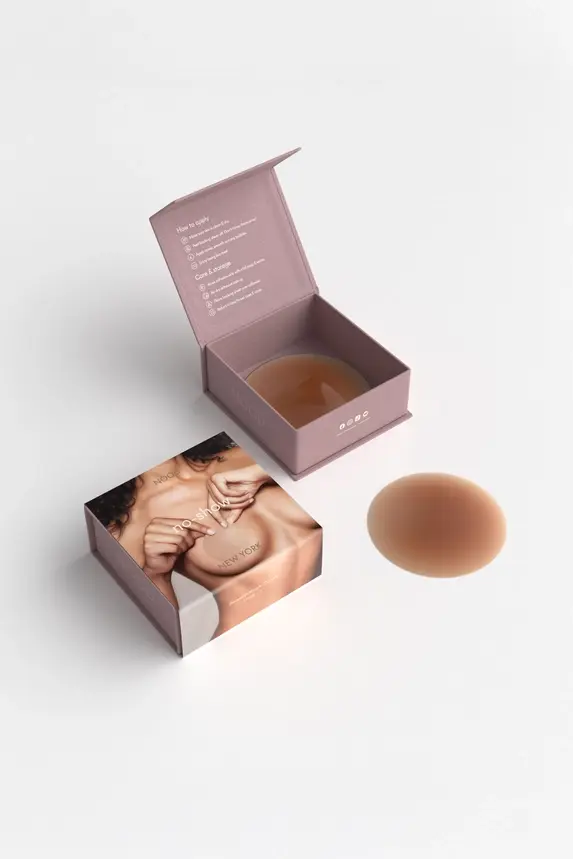 Thumbnail: Two nude silicone nipple covers with open box