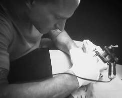 Legendary tattoo artist Troy Lane tattooing a client at Tattoos By Lou, Miami's Best #1 Tattoo Studio