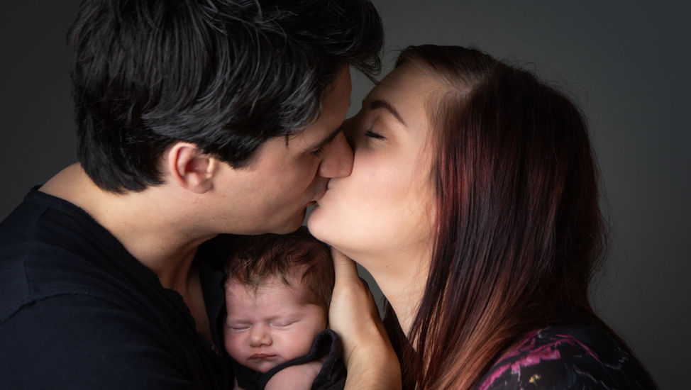newborn baby photo. Cute baby with lots of hair.