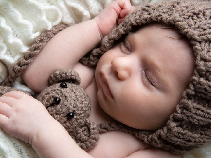 Sleeping newborn photo - baby cuddling teddy by Zen Shots Photography