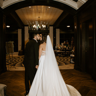 couple kissing with their backs to the camera