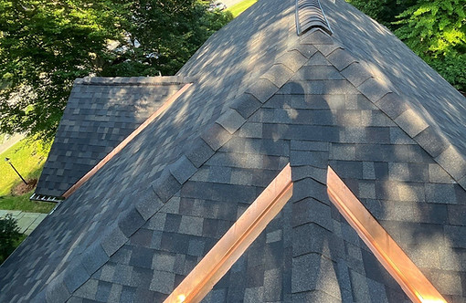 Finished Owens Corning Duration Designer roof with exposed copper valleys in Worcester, Massachusetts