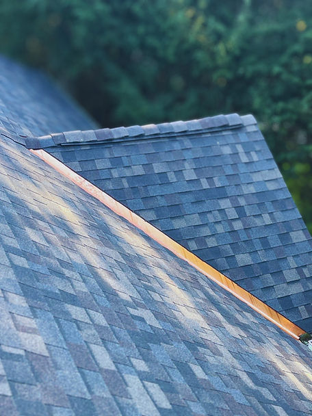 Owens Corning Duration Designer shingles with custom copper valley flashing on a Worcester, MA roof