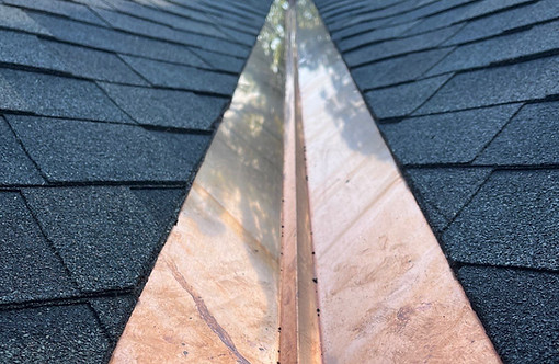 Close-up of custom copper valley flashing between Owens Corning Designer shingles in Worcester, MA