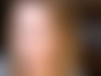 A closeup of a blonde caucasian girl with piercing blue eyes gazing into the camera.