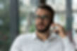 male-with-glasses-talking-phone.jpg