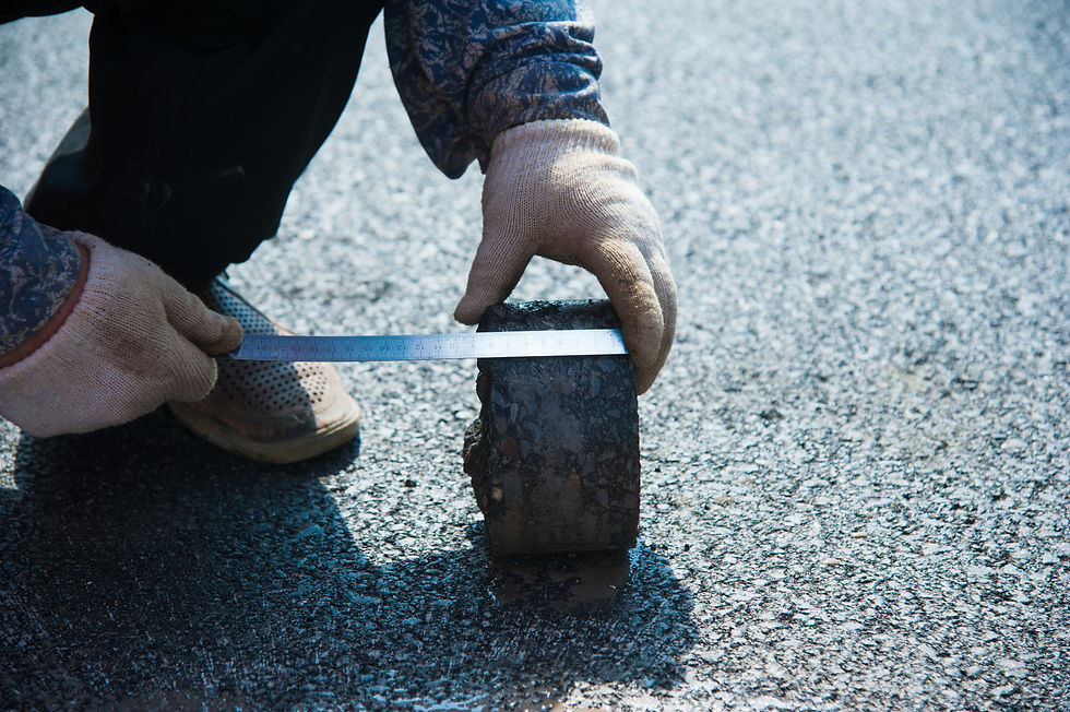Checking the quality of asphalt by taking samples and measuring the thickness of asphalt