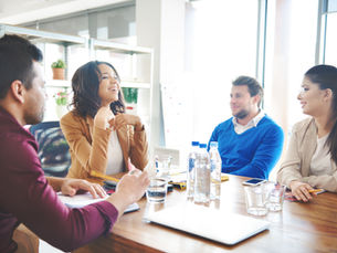 storyblocks-group-of-business-people-discussing-at-work