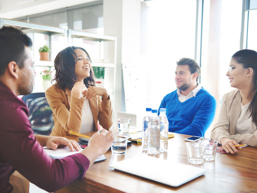 storyblocks-group-of-business-people-discussing-at-work