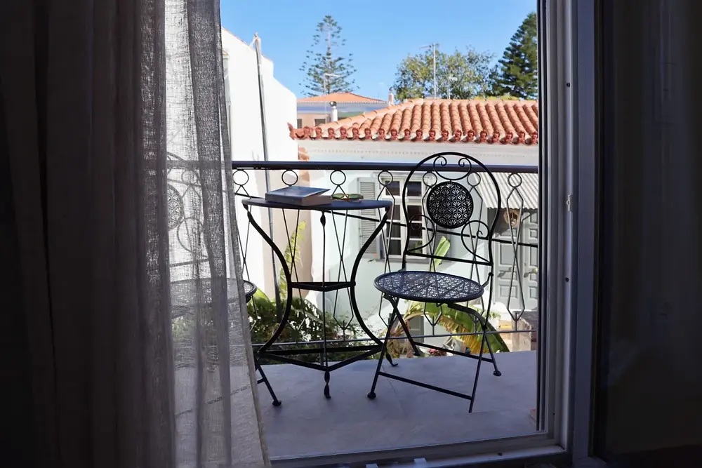 Private balcony with table and Aegina rooftop view, Axiotou House I