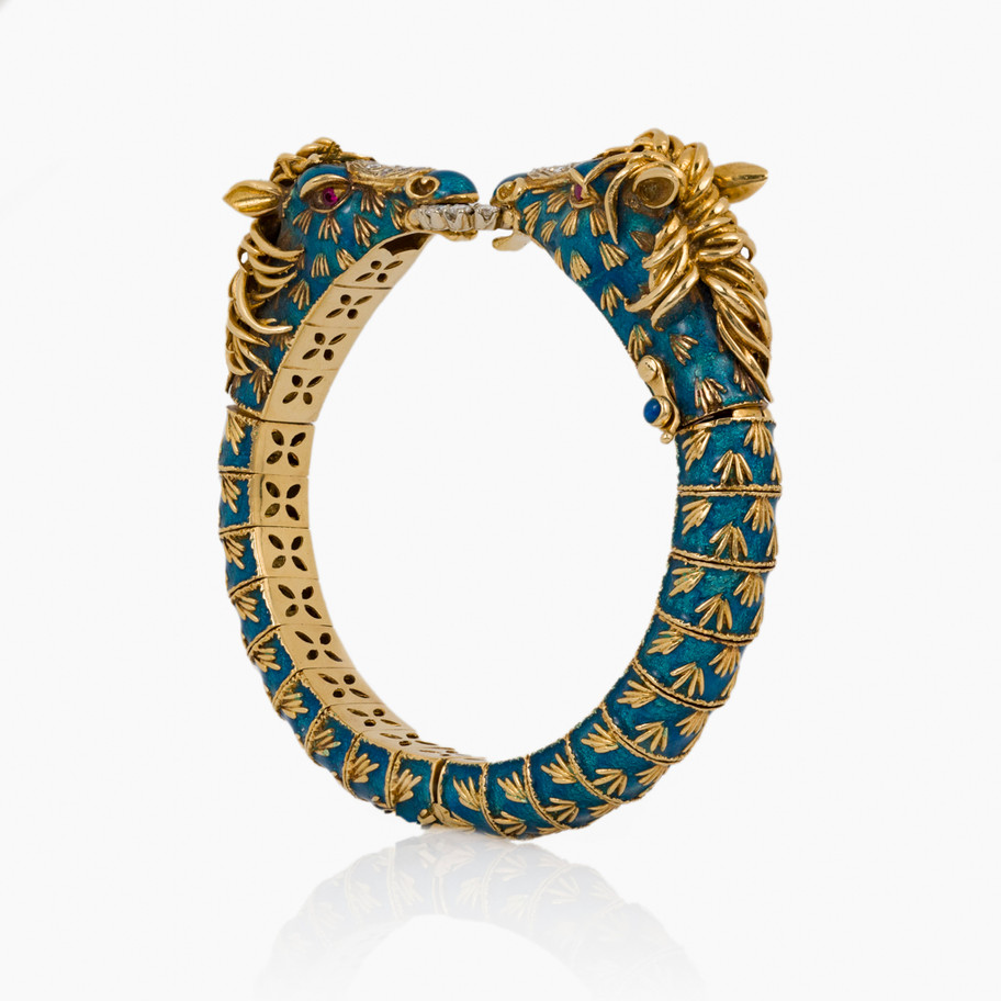 BRACCIALE SCULTURA FIRMATO FRASCAROLI IN ORO GIALLO 18 KT SMALTATO BLU CON TESTE DI CAVALLO