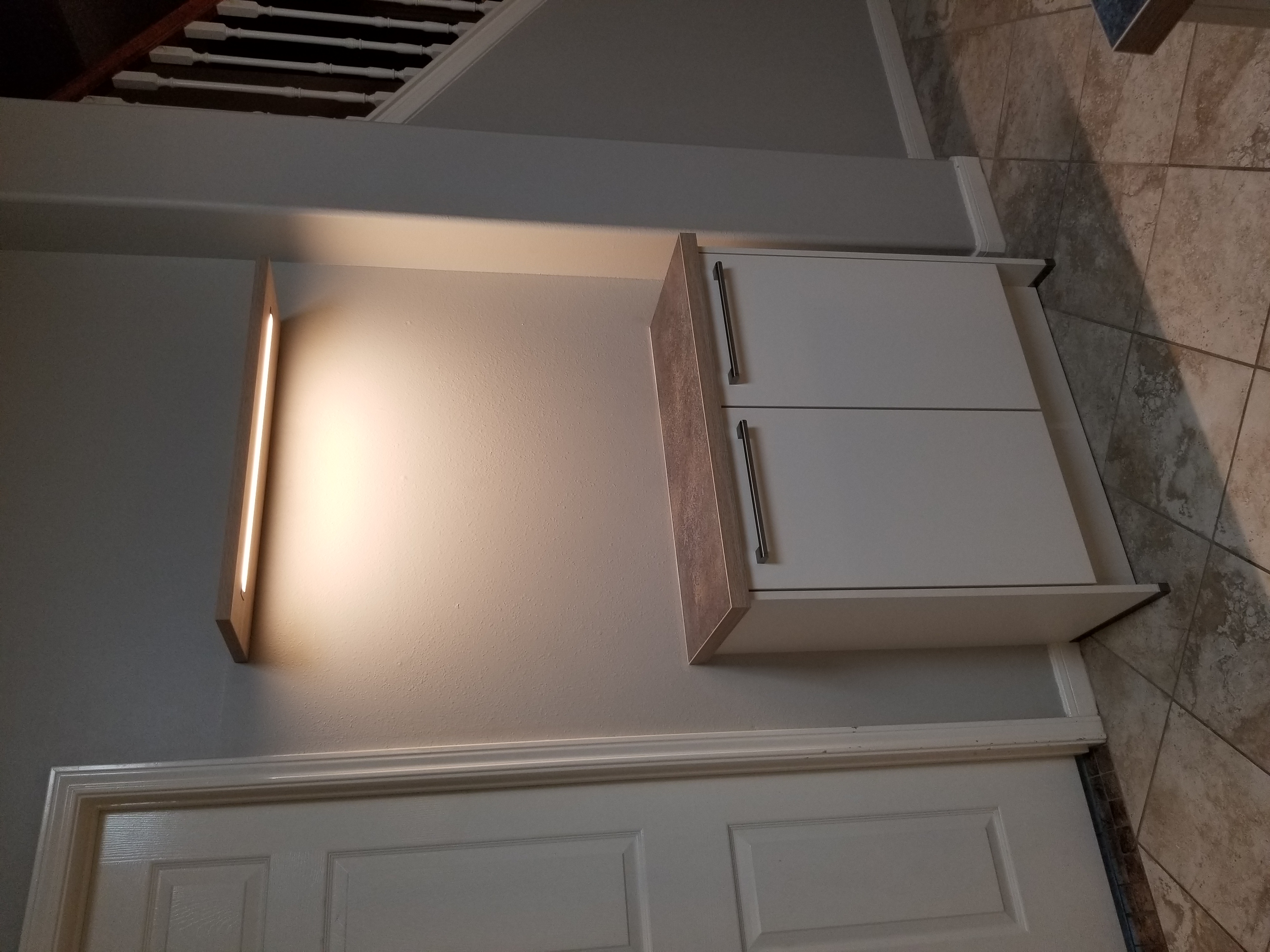 Kitchen with LED lighted wall shelf