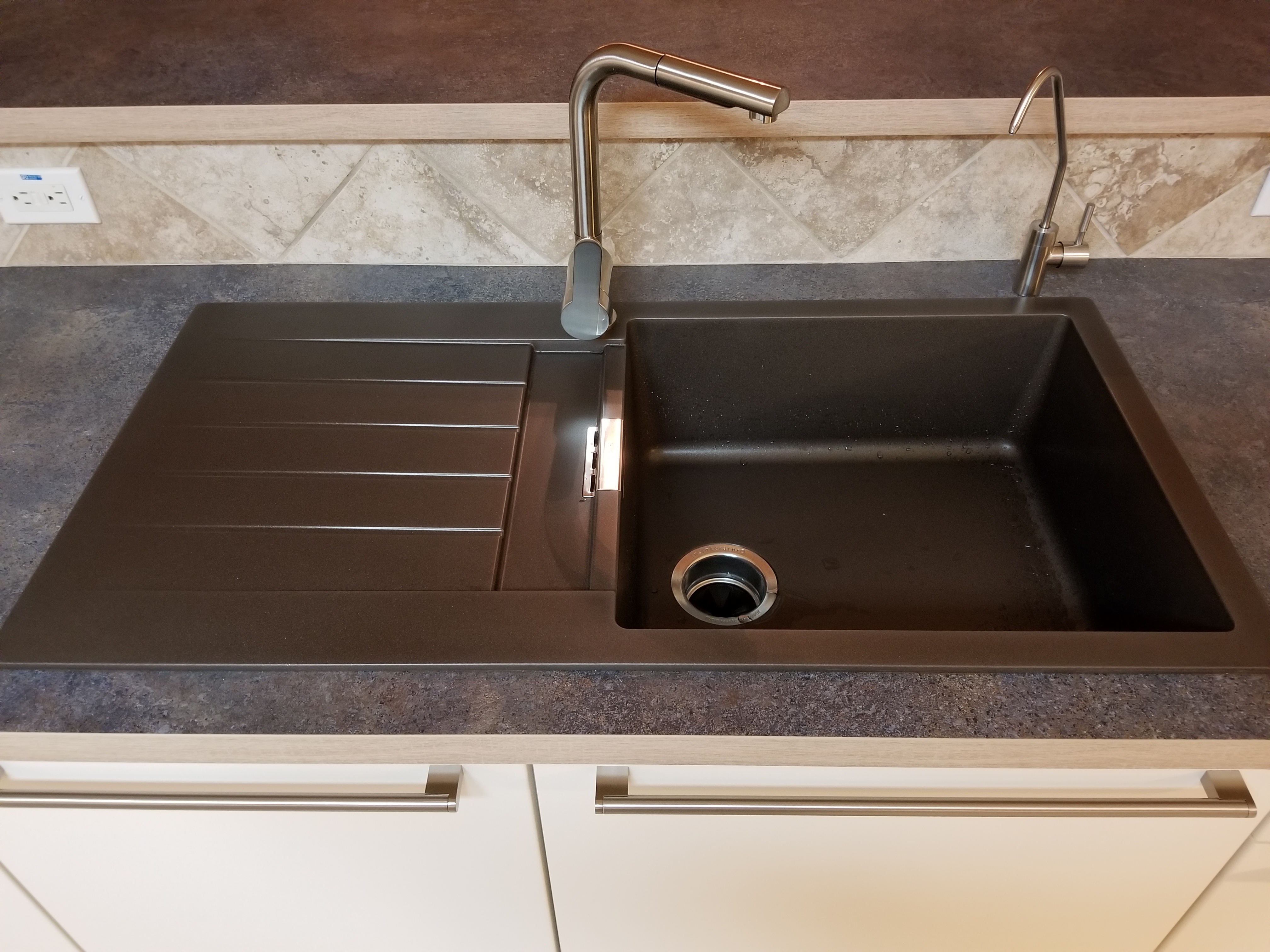 Granite kitchen sink in bronze color