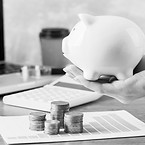 hand-holding-piggy-bank-with-growth-char