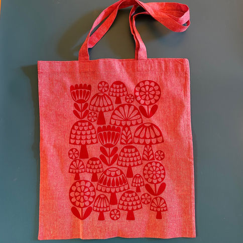Red tote bag with floral and mushroom print