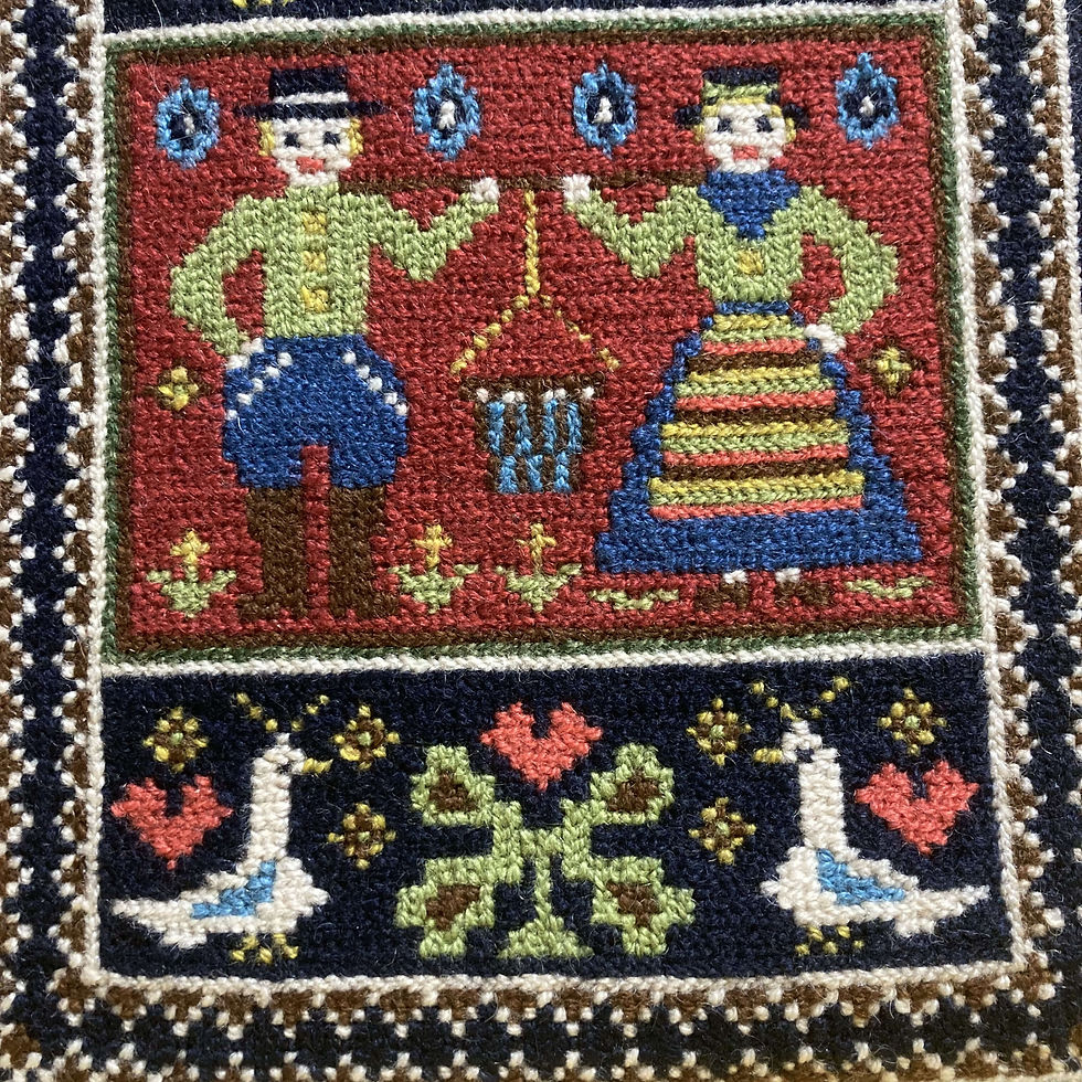 Hand-embroidered cushion: Folk figures, birds, flowers