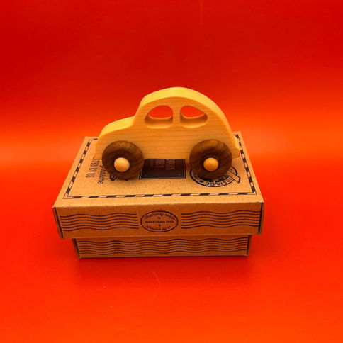 Wooden toy car in box