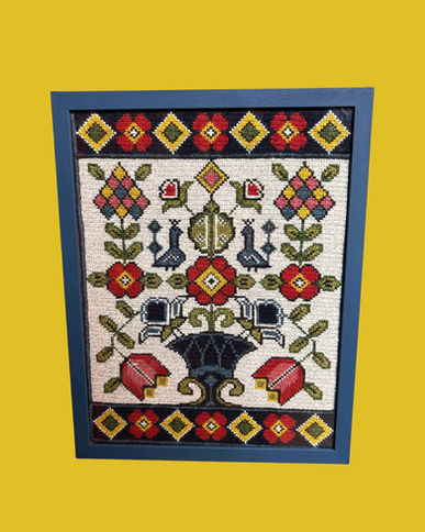 Framed floral needlepoint embroidery