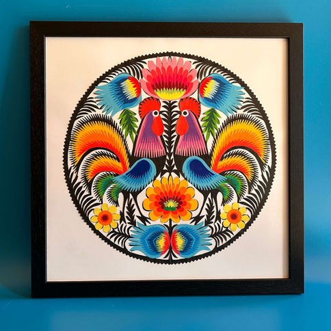 Vibrant papercut roosters framed