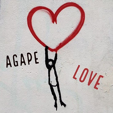 Drawing of a person hanging off a heart shaped balloon with the words agape love next to them
