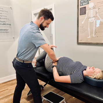 Chiropractor adjusting a pregnant woman