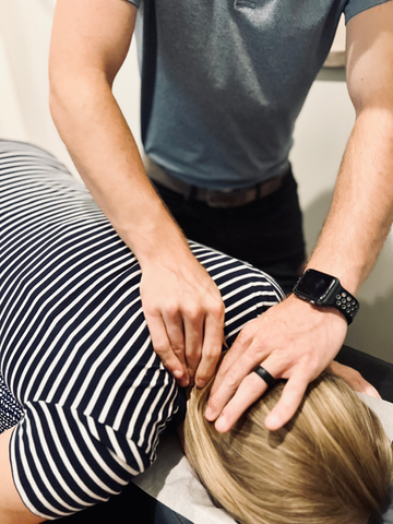 Chiropractor adjusting a patient's neck