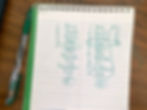 An example list of student names written on a spiral notepad in green pen. The names are numbered and circled to illustrate the process of selecting a student.