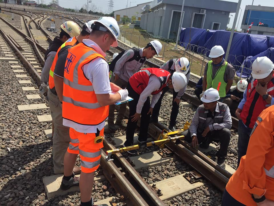 Eye-level view of a person using a laptop in a cozy home environment