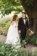 Bride and groom stroll through park path together for wedding at Bartram's Garden in Philadelphia, PA. Photographed by New Jersey Philly wedding photographer Madison Neumann Photography.
