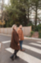 Fiancée's hold hands and go for a walk together in the fall around Princeton University in New Jersey. Engagement session photographed by South Jersey, Philadelphia based wedding photographer Madison Neumann Photography.